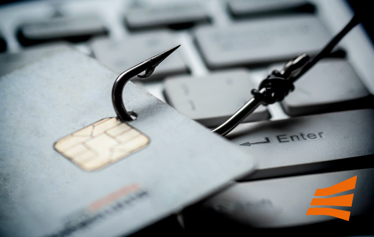 Na imagem: cartão de crédito sendo fisgado por uma isca de pesca, representando o aumento de golpes financeiros na internet durante a pandemia da COVID-19